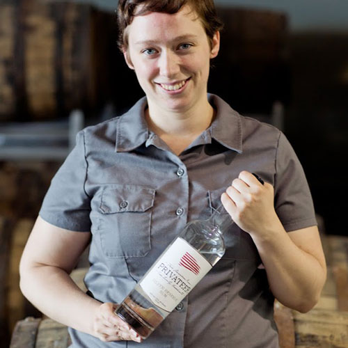 Maggie Campbell holding Silver Reserve Bottle at Privateer Rum